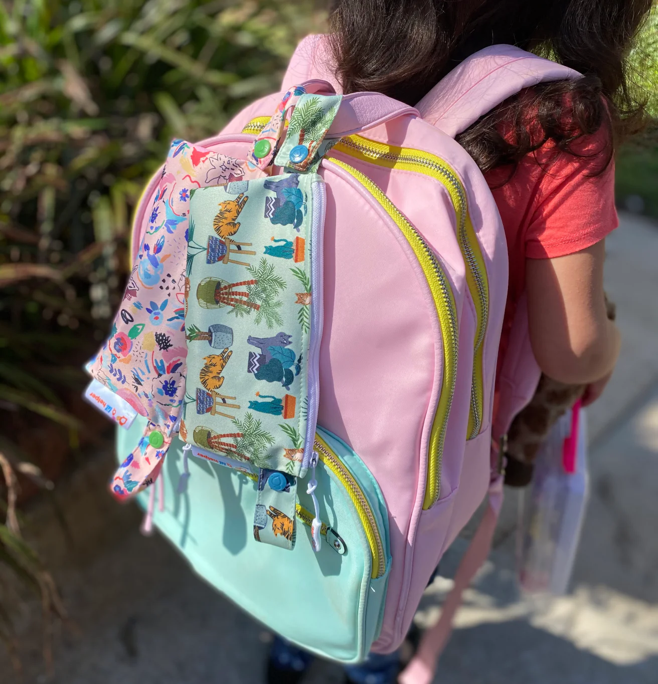 reusable snack bags on a child’s backpack